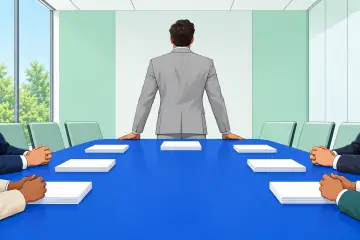 会議テーブルの先頭に立つスーツ姿の人物（後ろ姿）